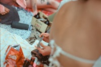 a group of people sitting on a blanket