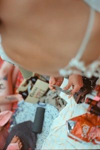 a group of people sitting on a blanket