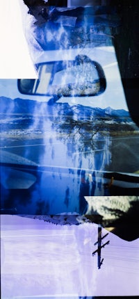 a reflection of a car in a mirror